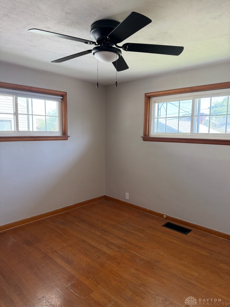 4924 Bayside Drive Riverside, OH 45431 - Photo 17 of 21 This bright room features durable hardwood flooring and a functional ceiling fan.