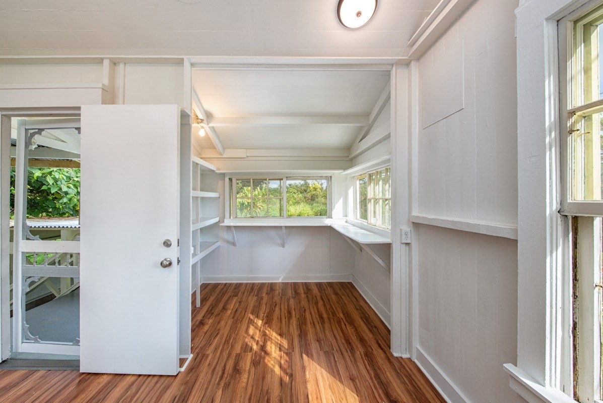 48-5314 Kukuihaele Road Honokaa, HI 96727 - Photo 11 of 24 a view of front door with wooden floor and a window