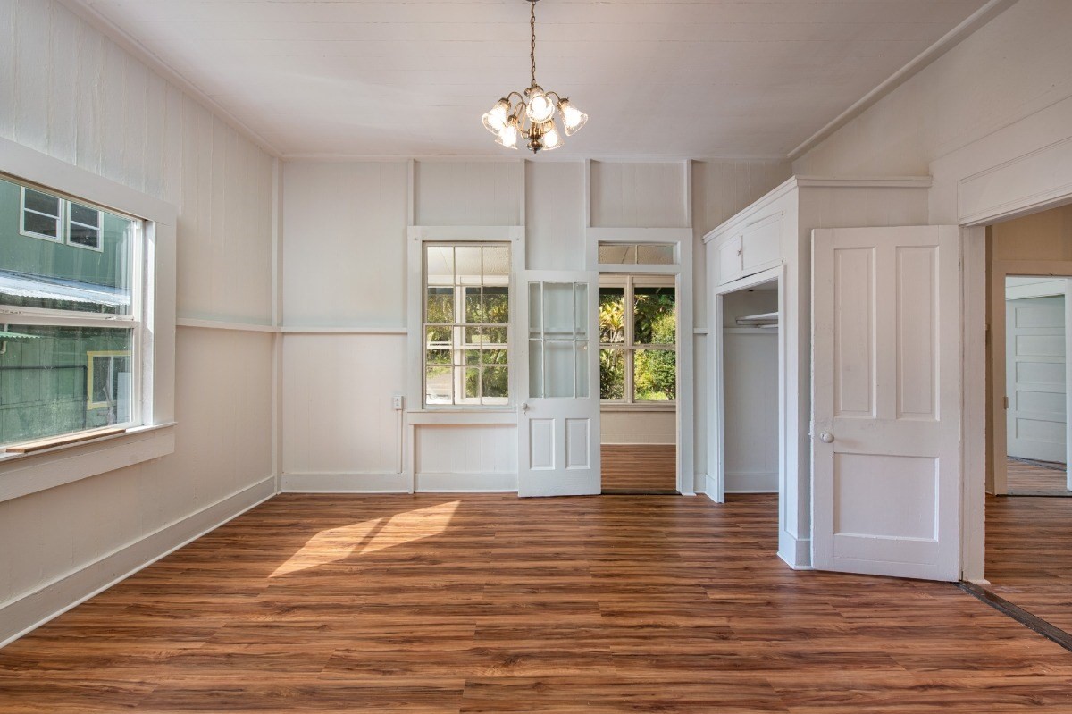 48-5314 Kukuihaele Road Honokaa, HI 96727 - Photo 12 of 24 a view of an empty room with wooden floor and a window
