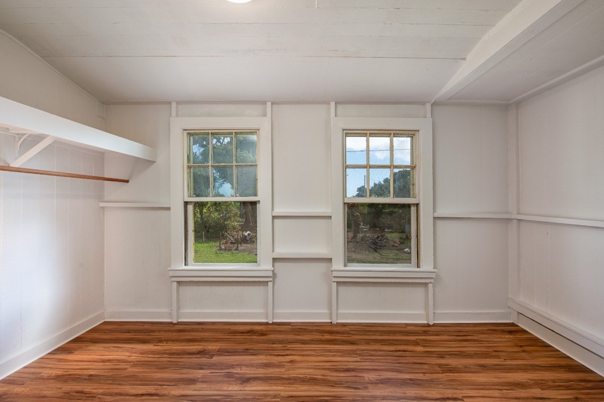 48-5314 Kukuihaele Road Honokaa, HI 96727 - Photo 15 of 24 an empty room with wooden floor and windows