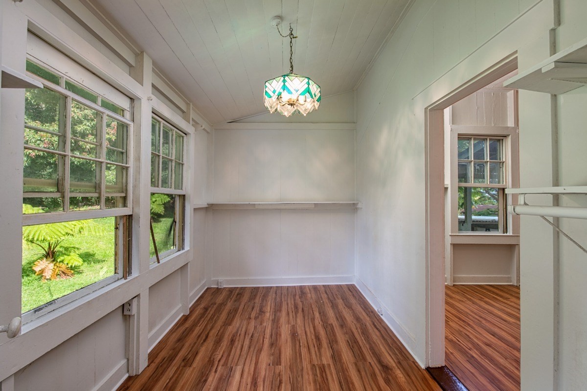 48-5314 Kukuihaele Road Honokaa, HI 96727 - Photo 16 of 24 a view of an empty room with wooden floor and a window