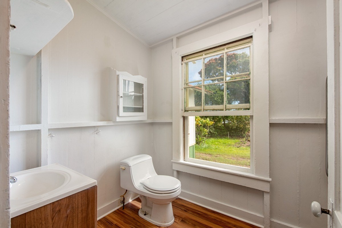 48-5314 Kukuihaele Road Honokaa, HI 96727 - Photo 17 of 24 a bathroom with a toilet a sink and a window