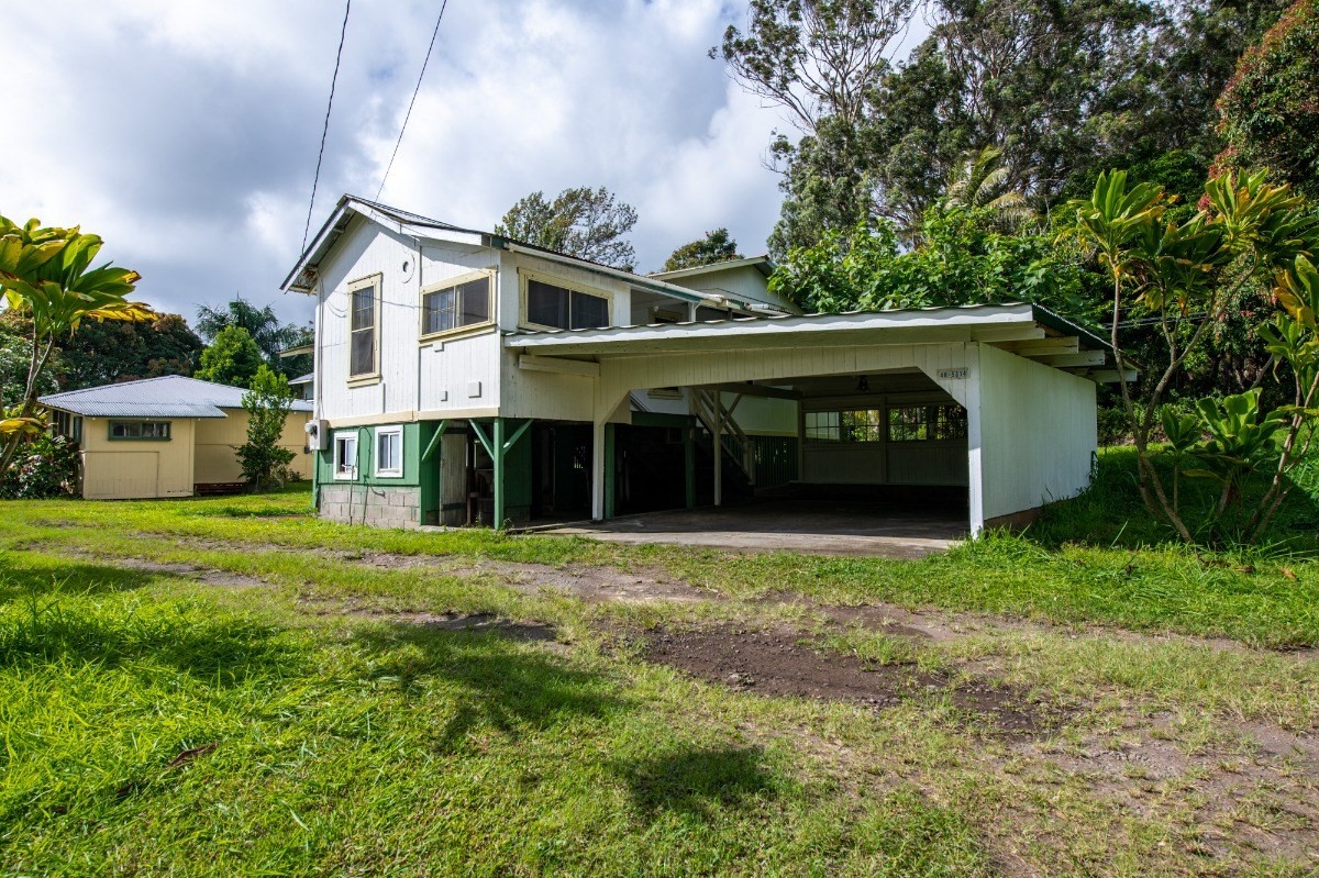 48-5314 Kukuihaele Road Honokaa, HI 96727 - Photo 22 of 24 a front view of a house with a garden