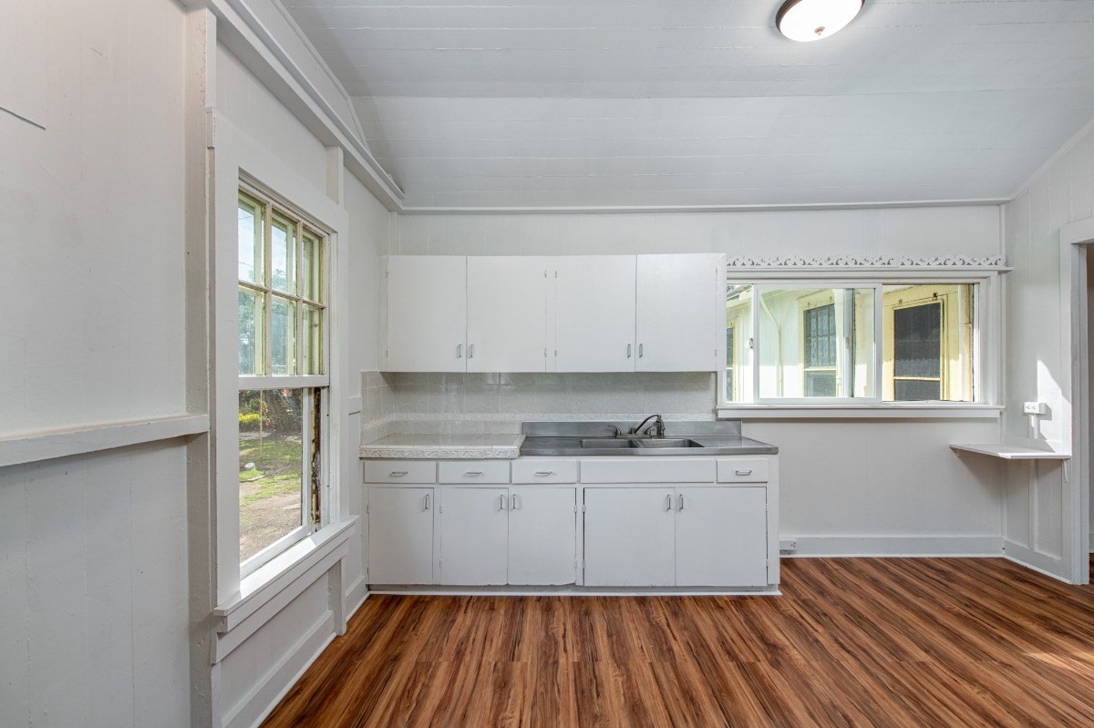 48-5314 Kukuihaele Road Honokaa, HI 96727 - Photo 9 of 24 a kitchen with wooden floors and sink