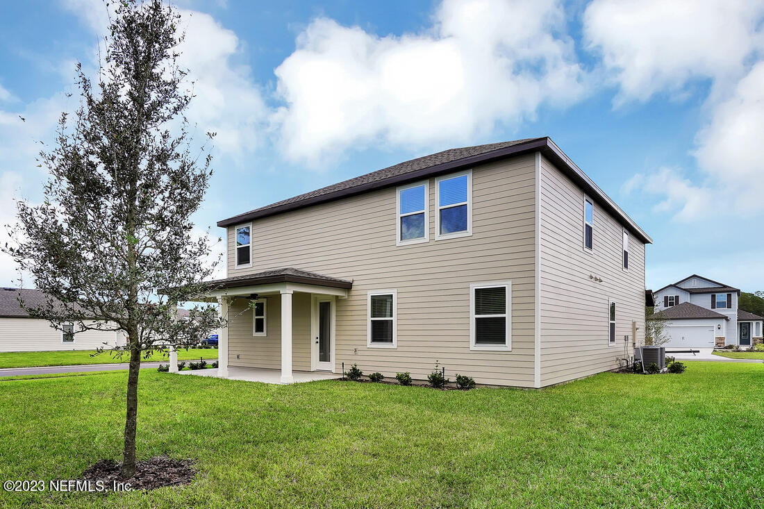 1074 Morgans Treasure Road St. Augustine, FL 32084 - Photo 11 of 11 a front view of a house with a garden