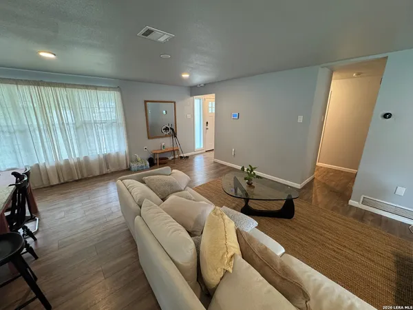 a living room with furniture and a window