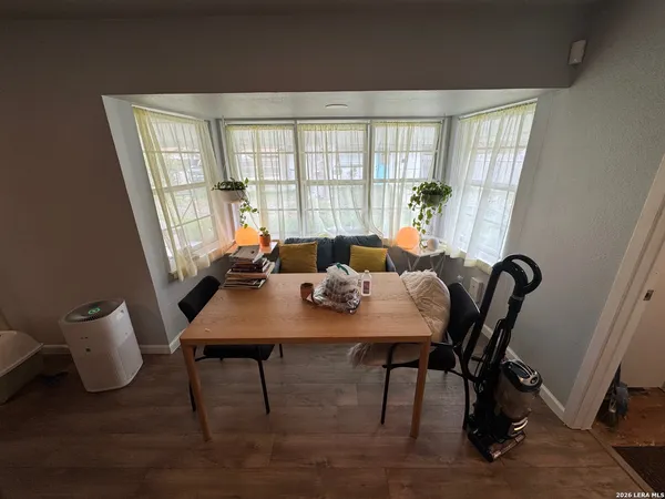 a view of a dining room with furniture window and outside view