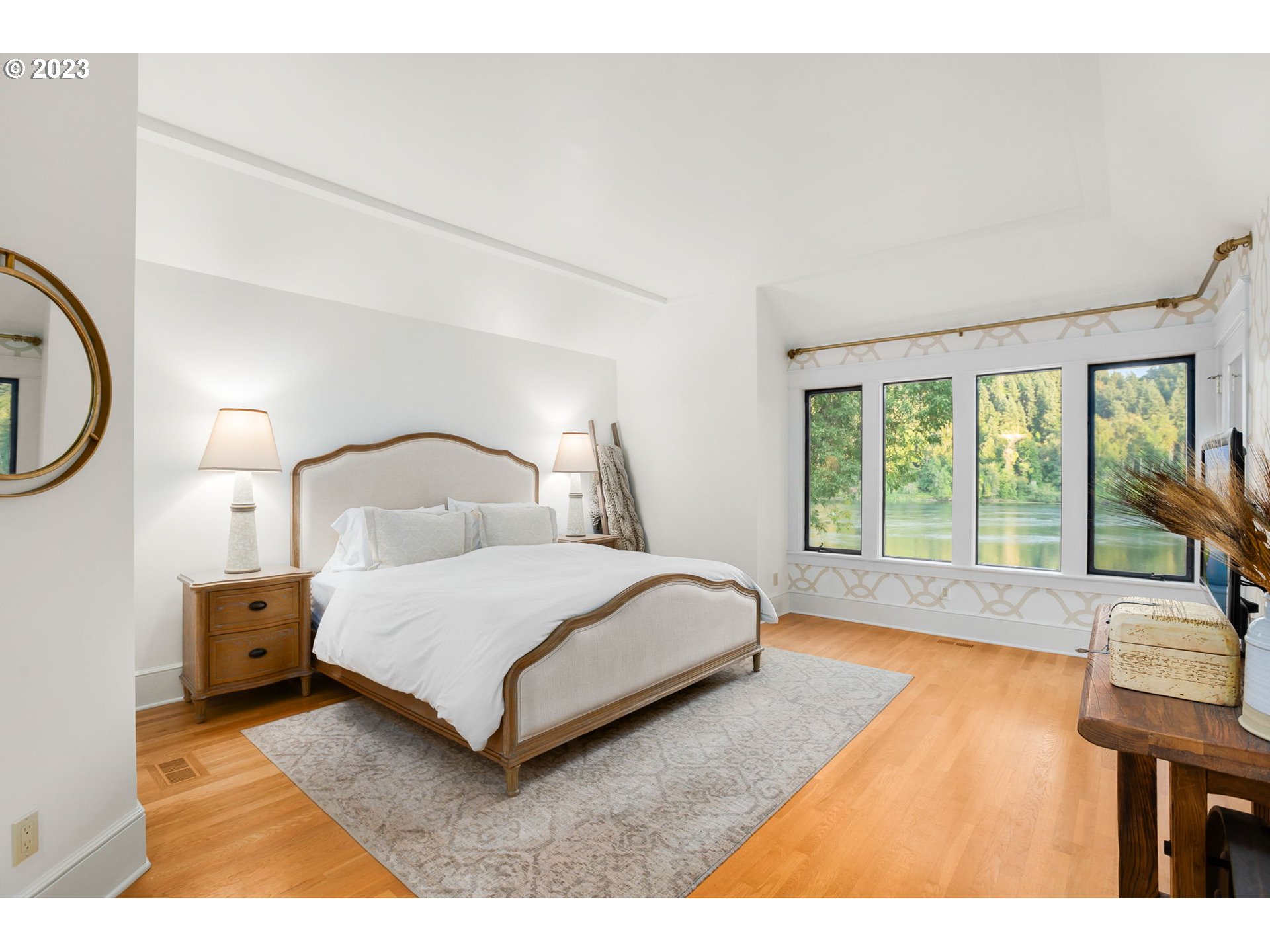 224 Southwest Forest Cove Road West Linn, OR 97068 - Photo 12 of 36 a bedroom with a bed window and a table in it