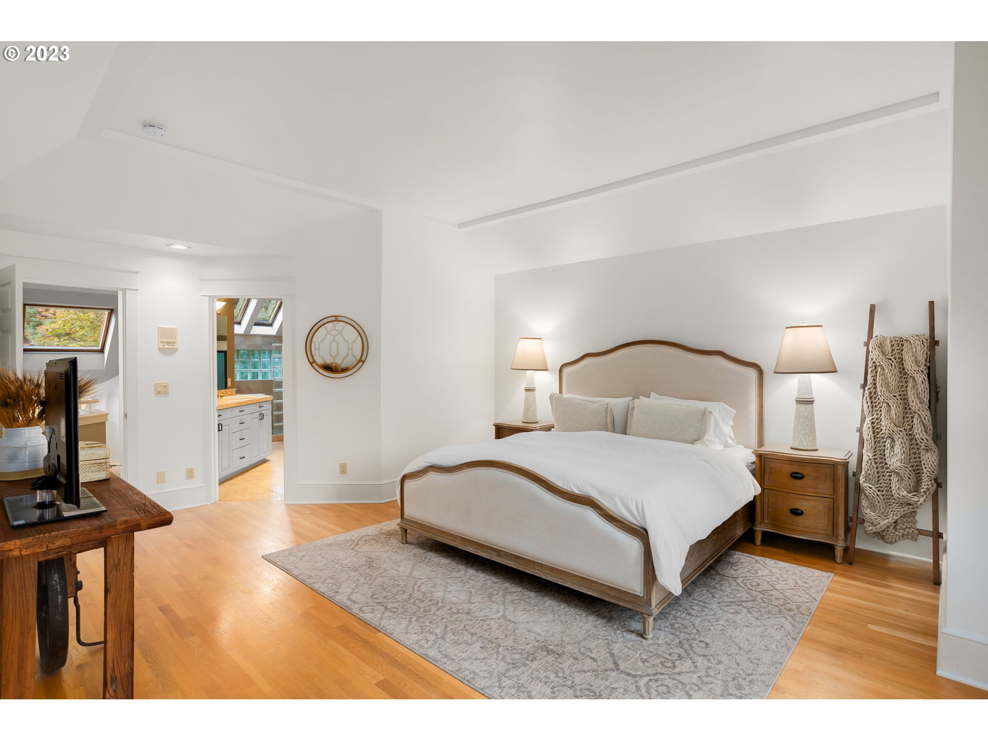 224 Southwest Forest Cove Road West Linn, OR 97068 - Photo 13 of 36 a bedroom with a bed a mirror and desk