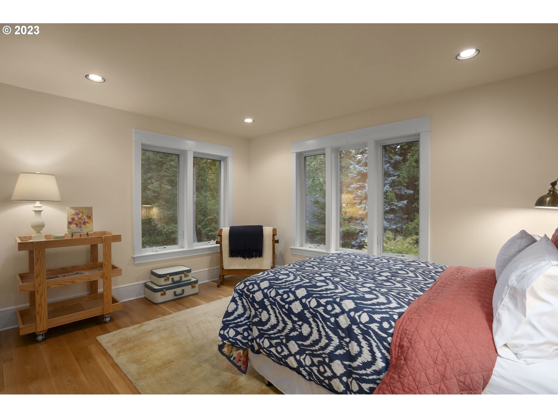 224 Southwest Forest Cove Road West Linn, OR 97068 - Photo 21 of 36 a bedroom with a bed and wooden floor