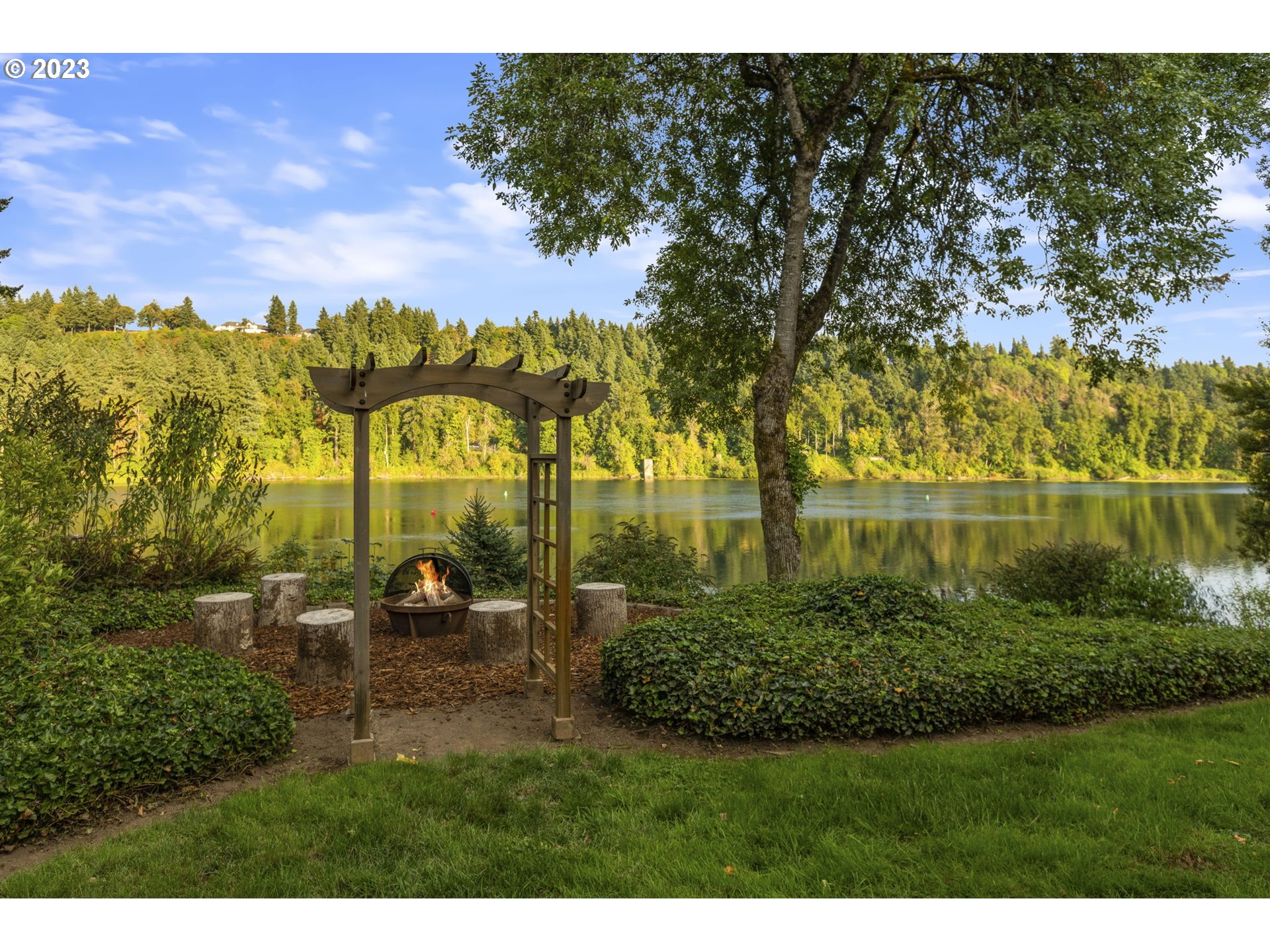 224 Southwest Forest Cove Road West Linn, OR 97068 - Photo 30 of 36 a view of a garden with a table and chairs