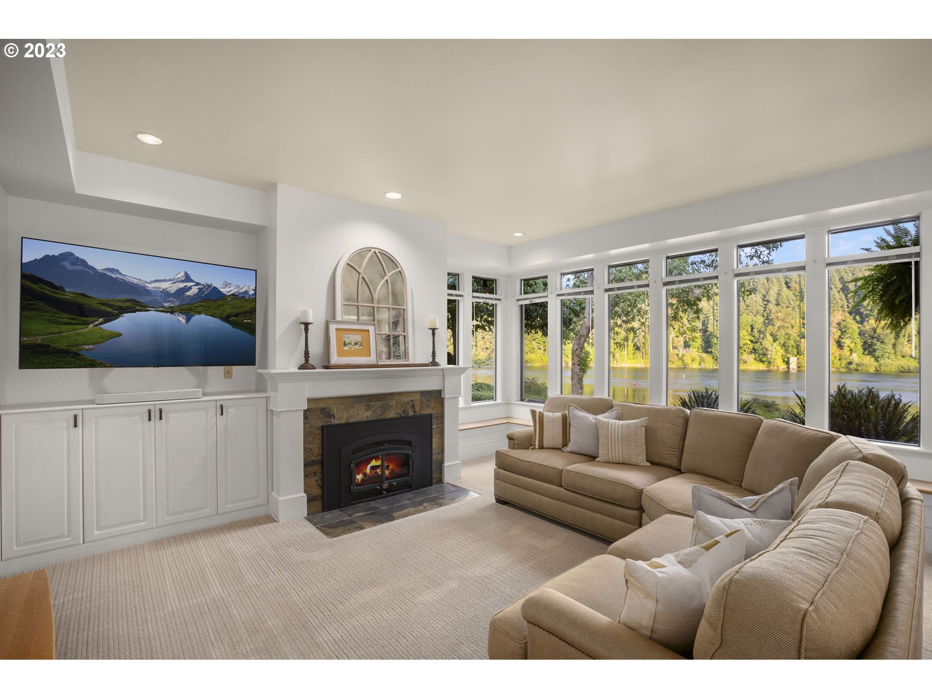 224 Southwest Forest Cove Road West Linn, OR 97068 - Photo 3 of 36 a living room with furniture a fireplace and a flat screen tv