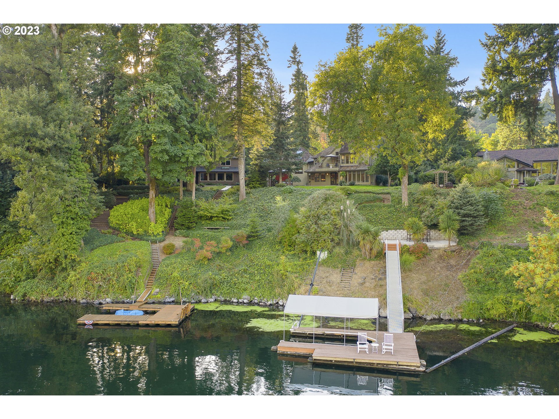 224 Southwest Forest Cove Road West Linn, OR 97068 - Photo 31 of 36 a backyard of a house with lots of green space