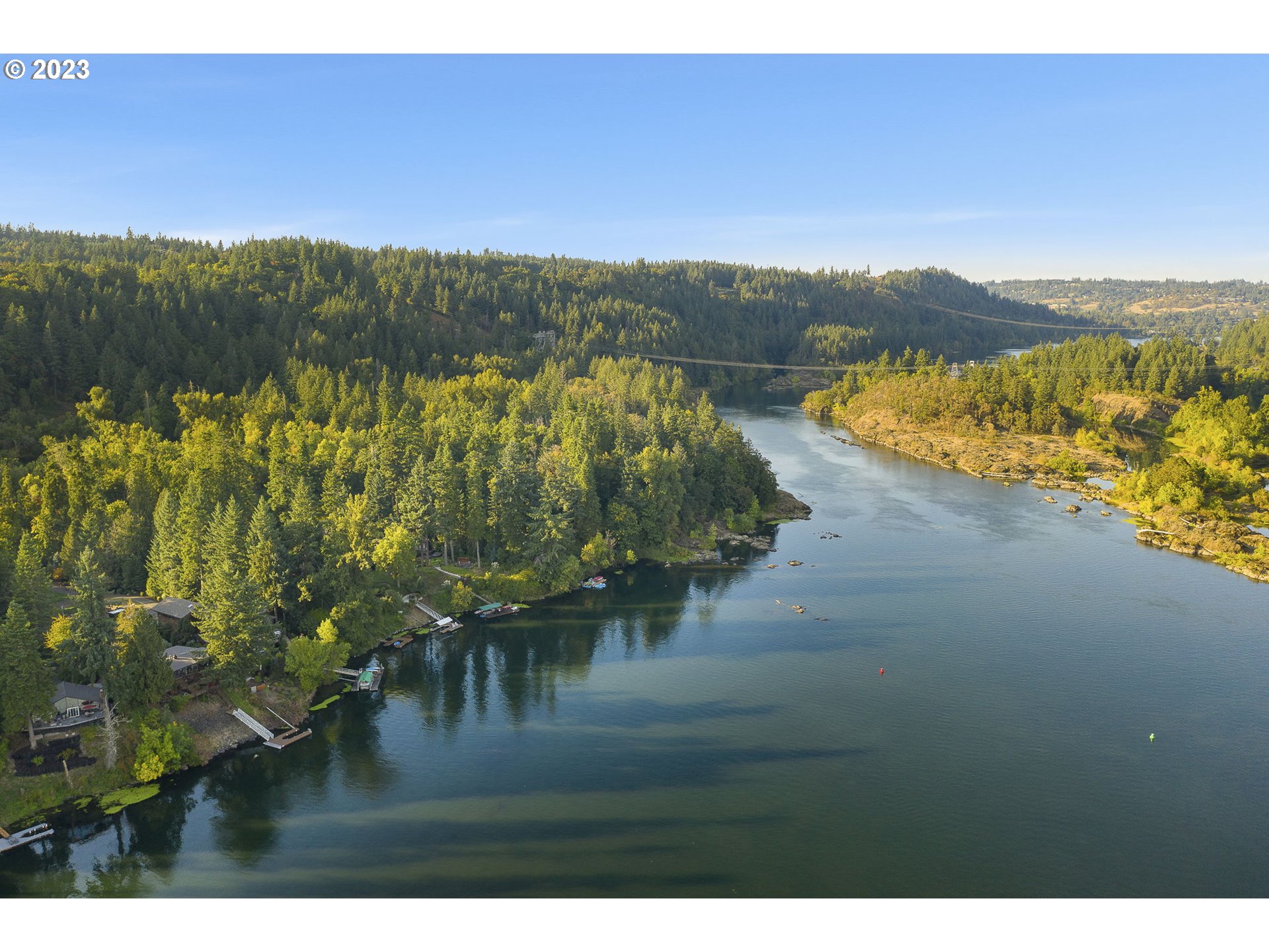 224 Southwest Forest Cove Road West Linn, OR 97068 - Photo 35 of 36 a view of a lake with a mountain in the background
