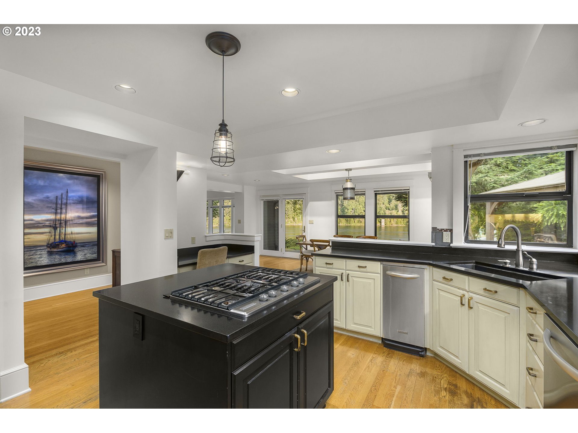 224 Southwest Forest Cove Road West Linn, OR 97068 - Photo 6 of 36 a kitchen with a sink stove and refrigerator
