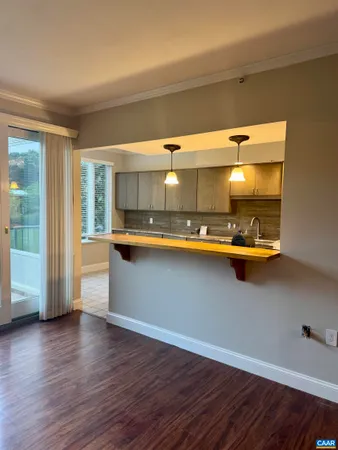 a kitchen with a large stove a sink dishwasher and cabinets next to a window