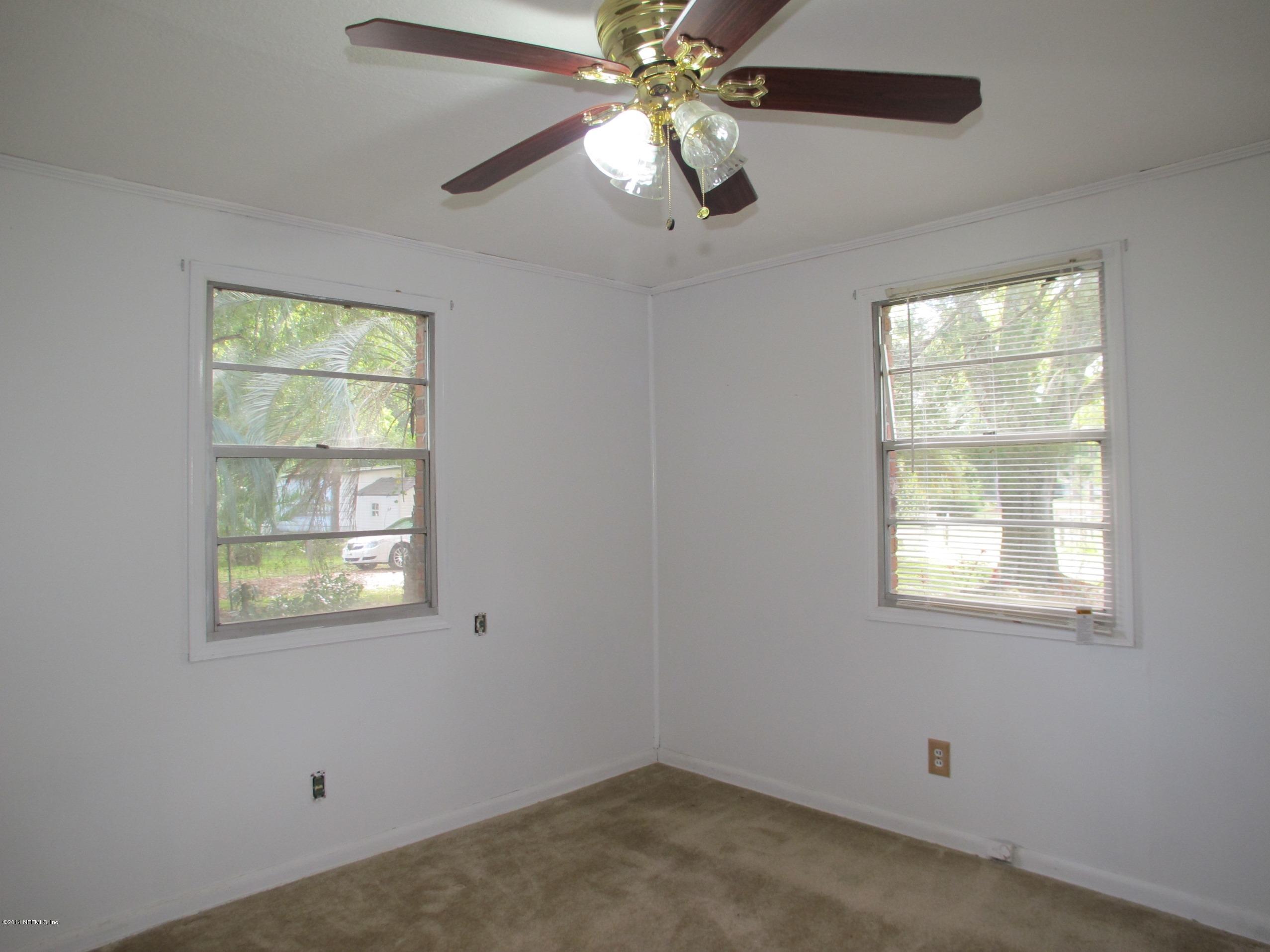 10593 Joes Road Jacksonville, FL 32221 - Photo 13 of 21 a view of an empty room with a window