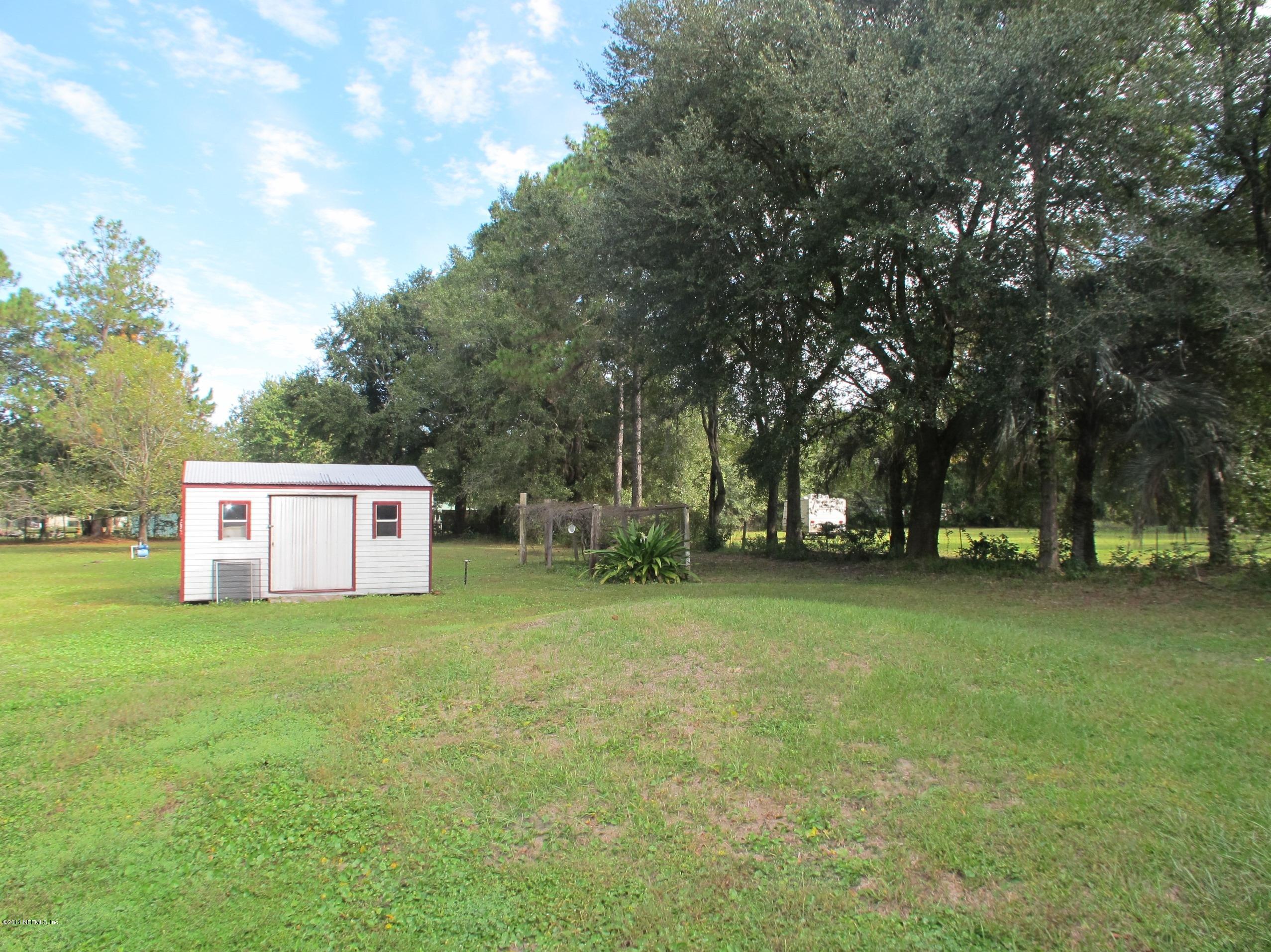 10593 Joes Road Jacksonville, FL 32221 - Photo 17 of 21 a view of a tree in a yard
