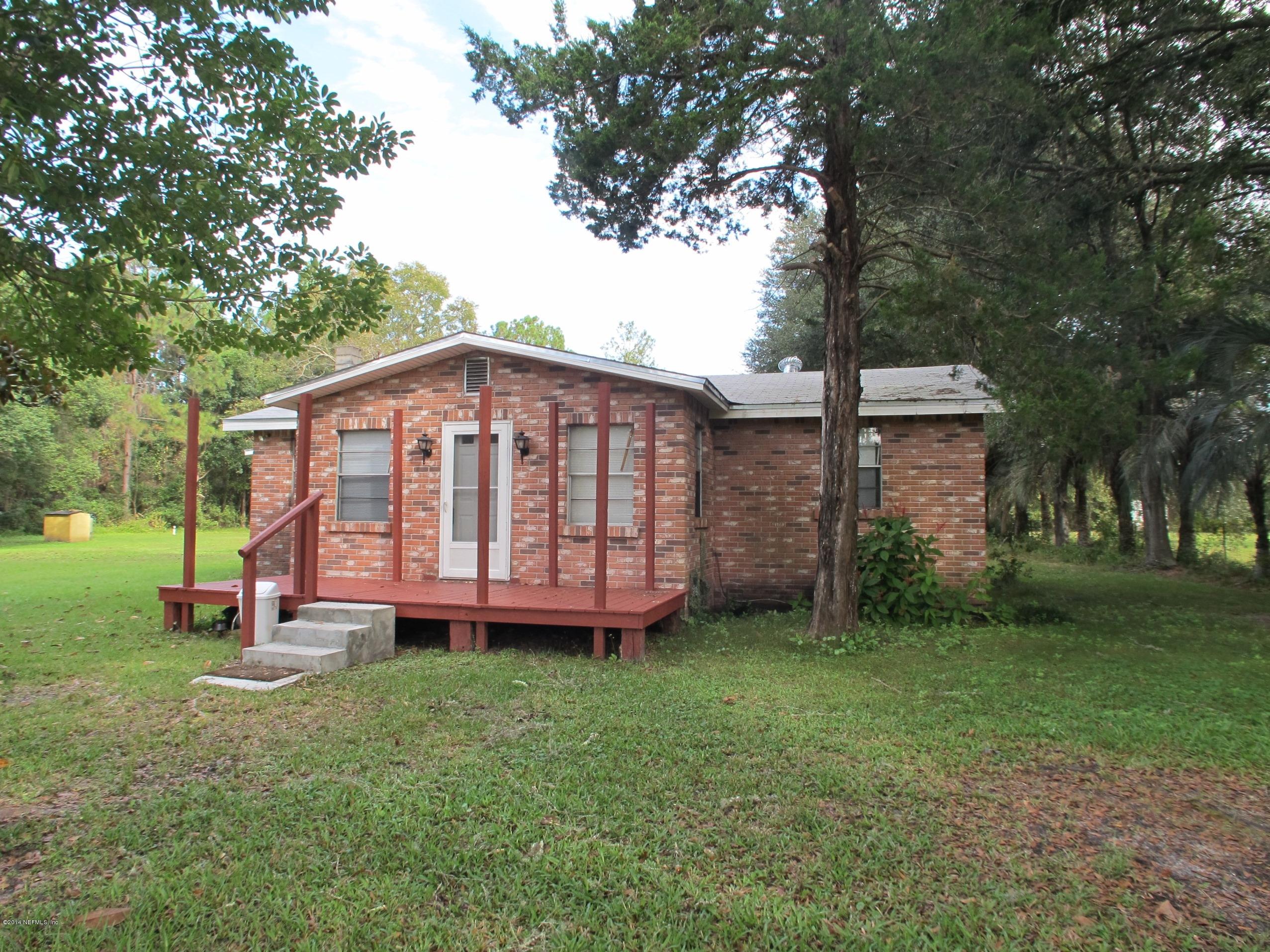 10593 Joes Road Jacksonville, FL 32221 - Photo 2 of 21 a view of a backyard with a garden