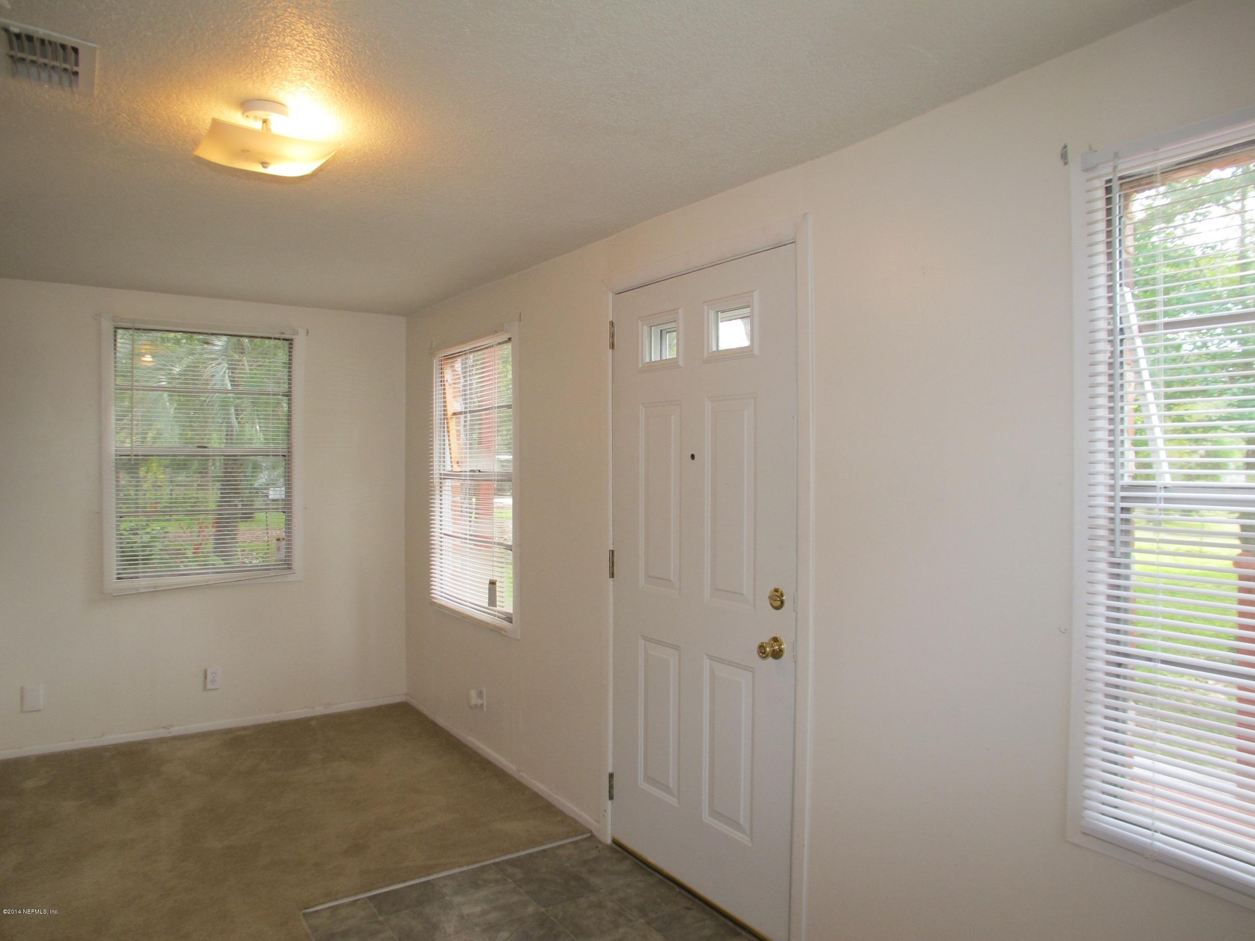 10593 Joes Road Jacksonville, FL 32221 - Photo 6 of 21 a view of an empty room with windows
