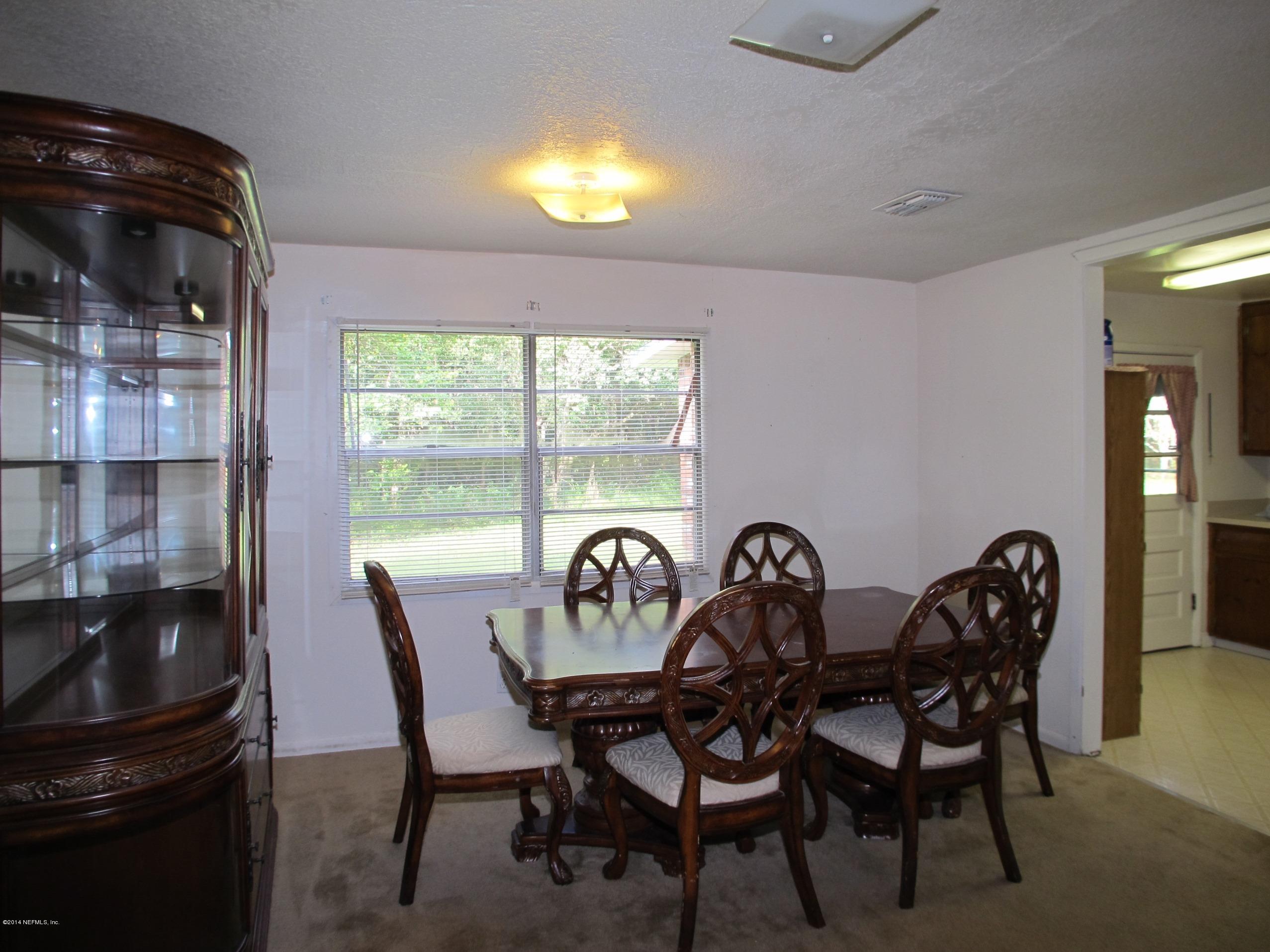 10593 Joes Road Jacksonville, FL 32221 - Photo 9 of 21 a dining room with furniture and window