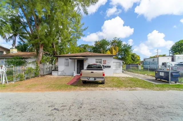 a car parked in front of a house