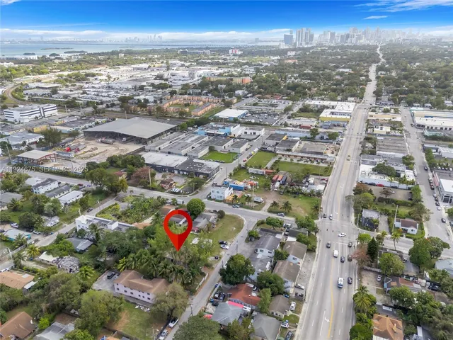 an aerial view of residential building with outdoor space and ocean