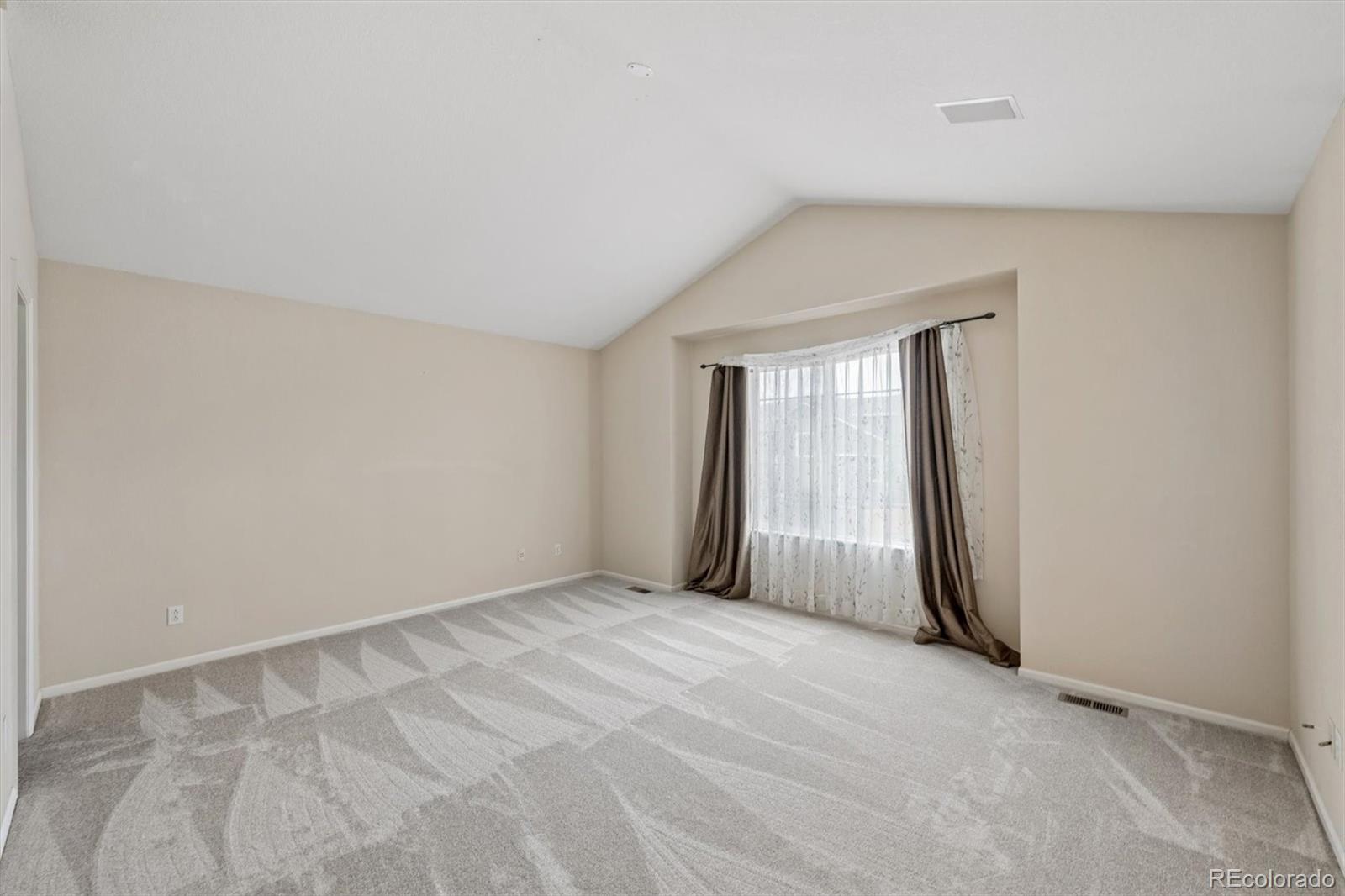 557 West Stellars Jay Drive Highlands Ranch, CO 80129 - Photo 19 of 41 a view of an empty room with a window