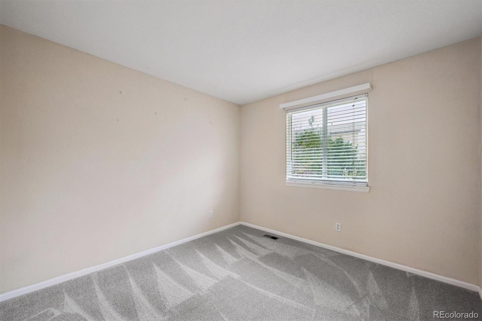 557 West Stellars Jay Drive Highlands Ranch, CO 80129 - Photo 23 of 41 an empty room with a window
