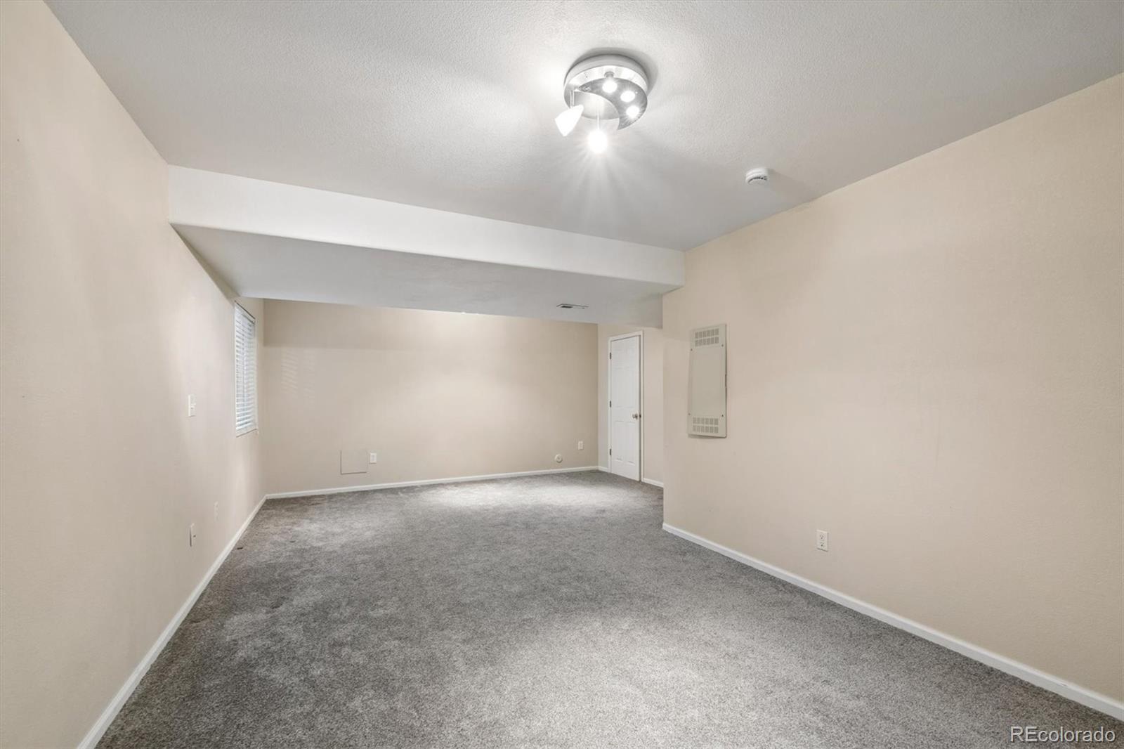 557 West Stellars Jay Drive Highlands Ranch, CO 80129 - Photo 27 of 41 an empty room with a empty space and a window