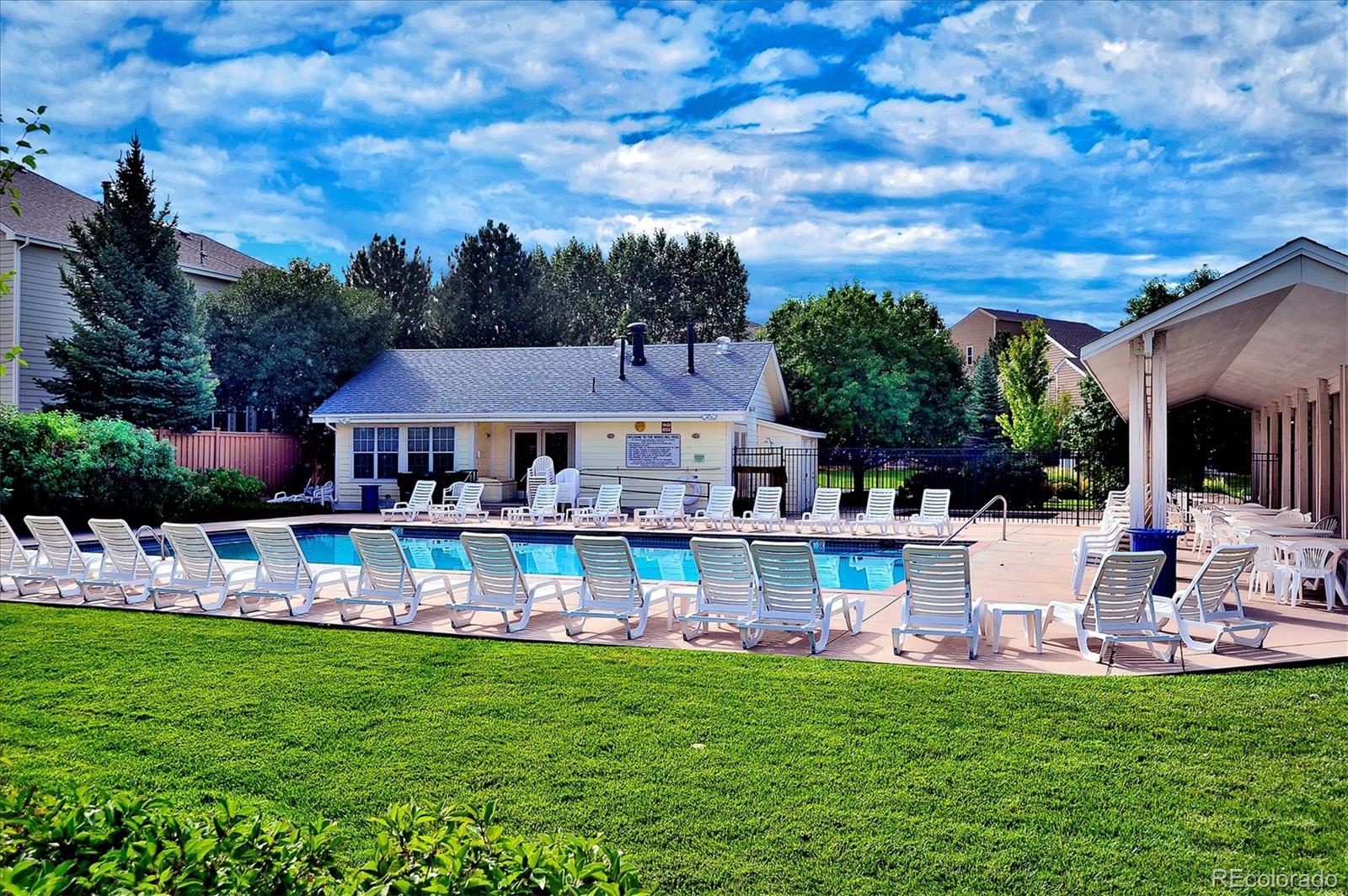 557 West Stellars Jay Drive Highlands Ranch, CO 80129 - Photo 37 of 41 a view of a house with pool and chairs