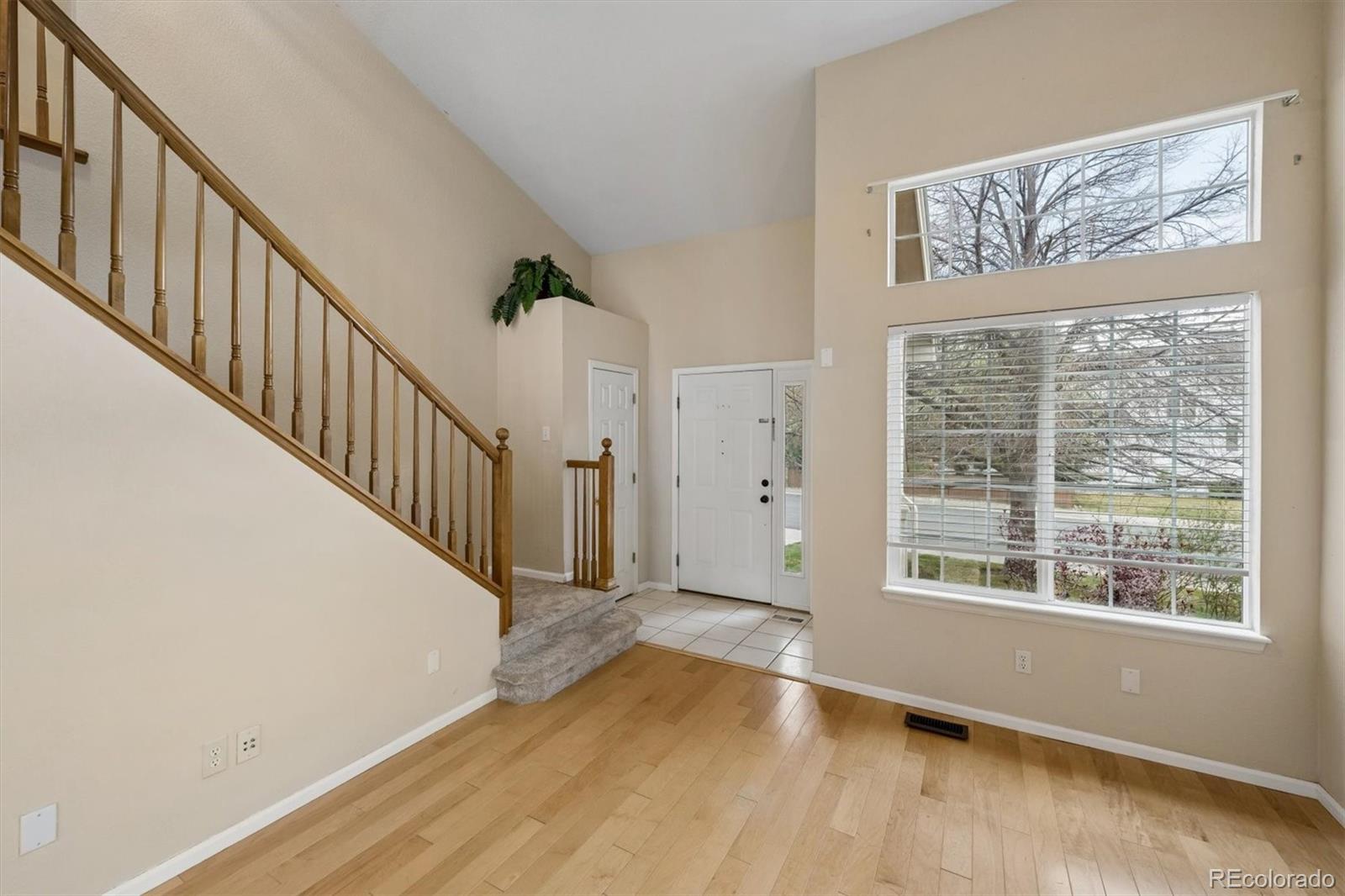 557 West Stellars Jay Drive Highlands Ranch, CO 80129 - Photo 4 of 41 a view of an entryway with wooden floor