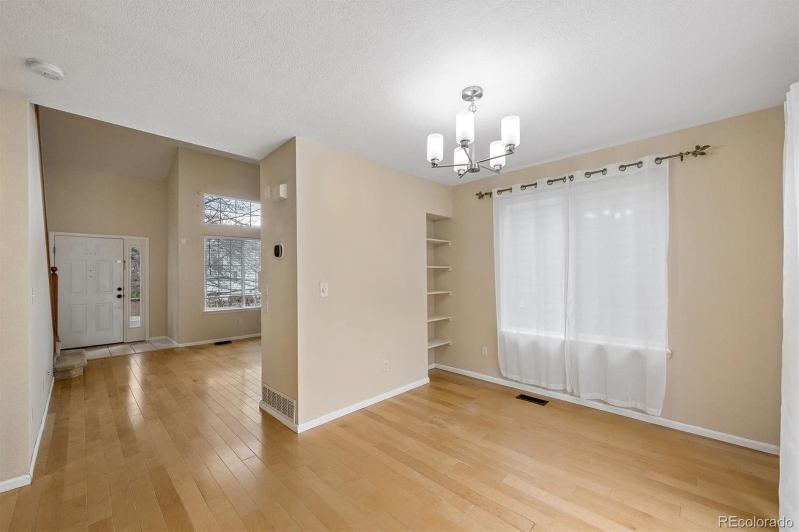 557 West Stellars Jay Drive Highlands Ranch, CO 80129 - Photo 8 of 41 a view of a chandelier in a room