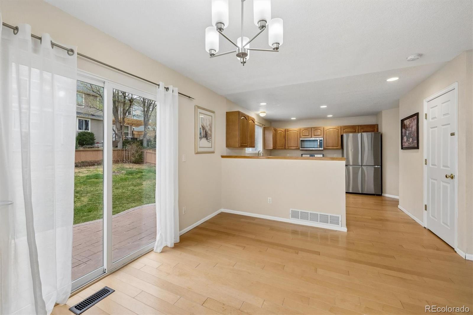 557 West Stellars Jay Drive Highlands Ranch, CO 80129 - Photo 10 of 41 a view of a big room with wooden floor and windows