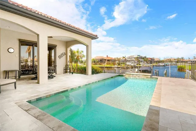 a view of a patio with swimming pool