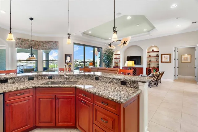 a kitchen with stainless steel appliances granite countertop a stove and a sink