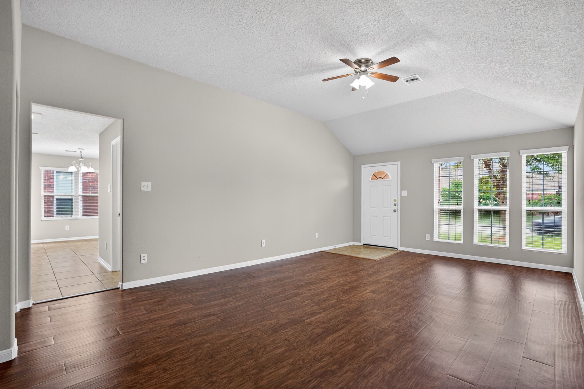 29414 Winton Wood Way Spring, TX 77386 - Photo 28 of 35 a view of an empty room with wooden floor and a window
