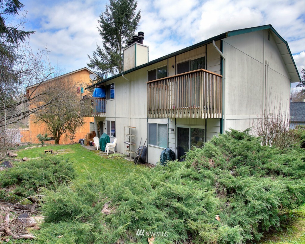 3919 Mason Loop Road Tacoma, WA 98409 - Photo 5 of 20 a house view with a garden space