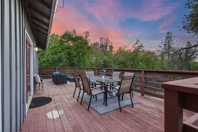 a living room with furniture a fireplace and a table