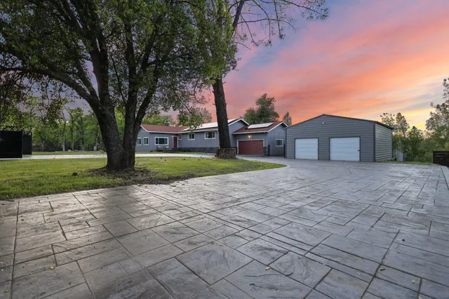 a view of a livingroom with furniture window and wooden floor