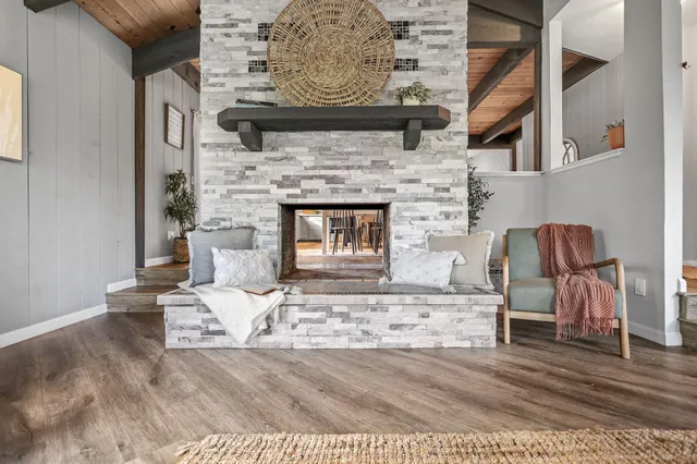 a bedroom with a bed and a potted plant