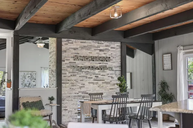 a view of a house with a wooden deck