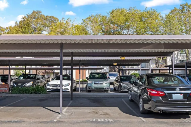 a building outdoor space with patio furniture and potted plants