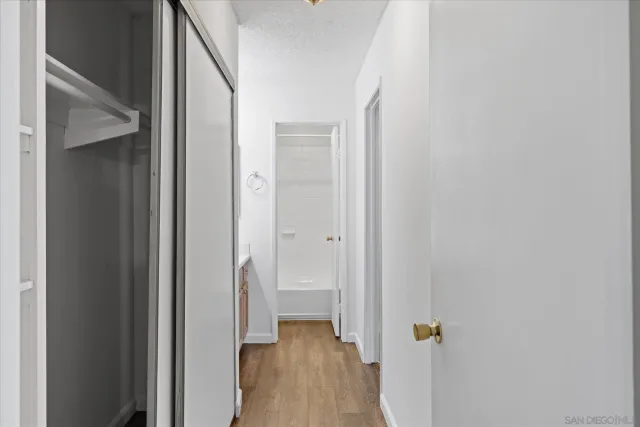 an empty room with a bathroom and a sink