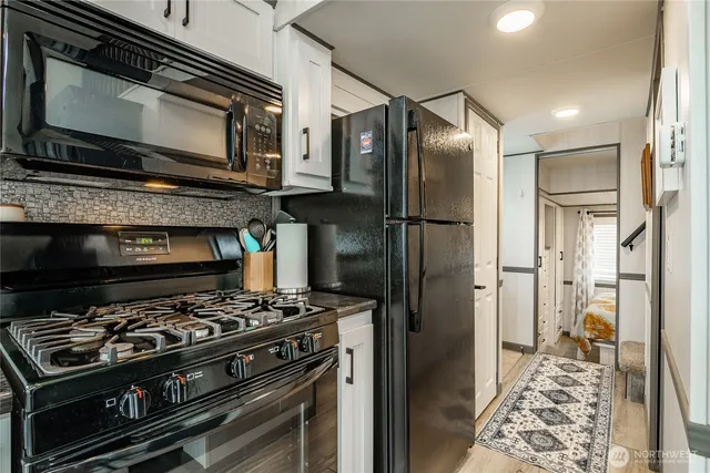 a kitchen with a stove and a microwave