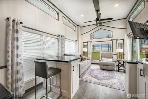 a kitchen with stainless steel appliances granite countertop a stove and a refrigerator