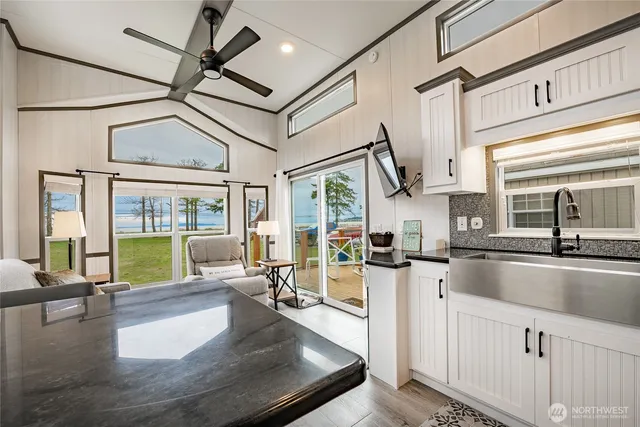 a kitchen with sink stove and cabinets