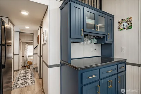 a kitchen with stainless steel appliances a refrigerator and cabinets