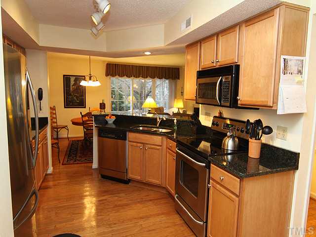 7753 Falcon Rest Circle Raleigh, NC 27615 - Photo 6 of 15 Enjoy cooking in this luxurious space while you entertain your guests. There is plenty of room for multiple cooks in this kitchen!