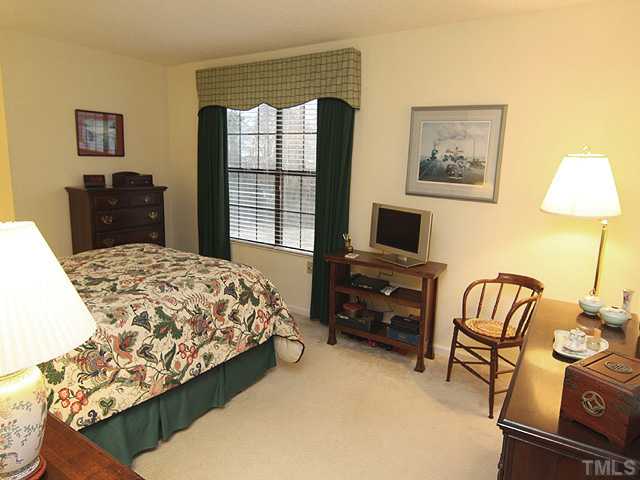 7753 Falcon Rest Circle Raleigh, NC 27615 - Photo 8 of 15 This spacious Second Floor Master Bedroom Suite has plenty of room for a sitting area. Enjoy the privacy of the backyard from the large double windows. Custom draperies and window treatments convey.